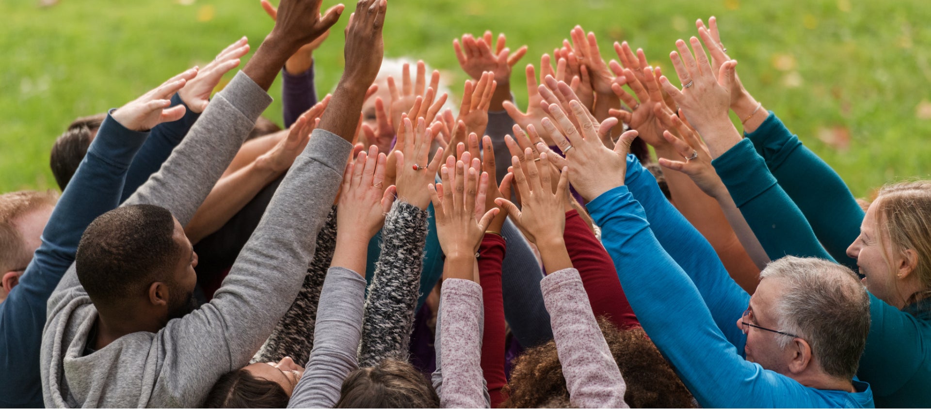 Group of people with hands raised Group of people with hands raised.